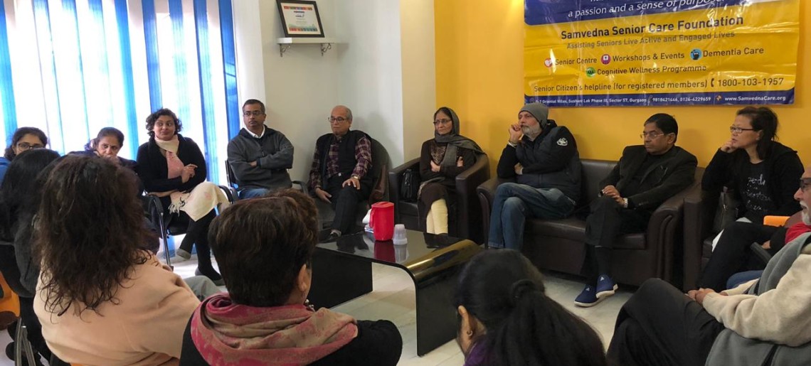 Discussion on caregiver stress and coping strategies at support group meeting